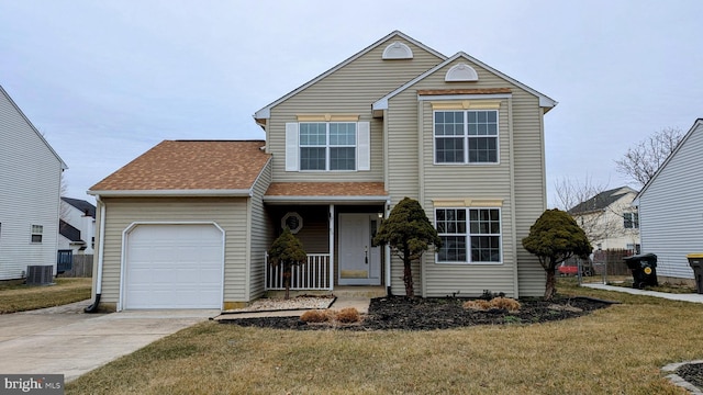 view of front property with a porch, a garage, central AC unit, and a front lawn