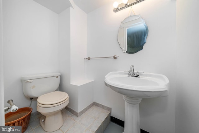 bathroom featuring tile patterned floors and toilet