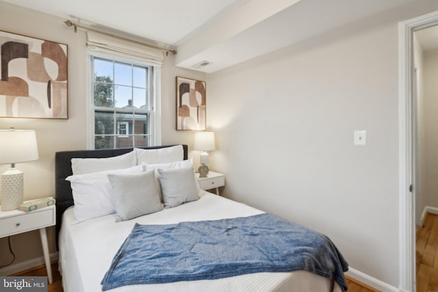 bedroom featuring wood-type flooring