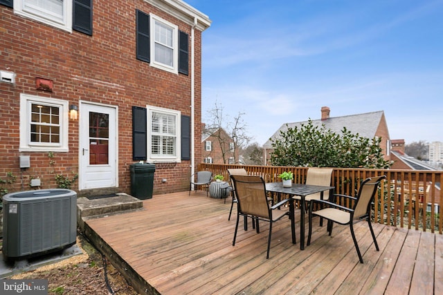 wooden terrace featuring central AC unit