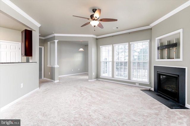 unfurnished living room with ornamental molding, ceiling fan, and carpet