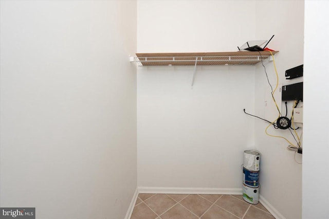 spacious closet with tile patterned floors