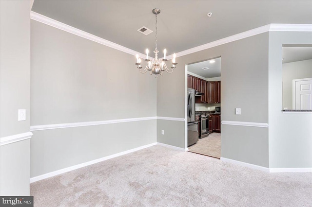 spare room with light colored carpet, ornamental molding, and a chandelier