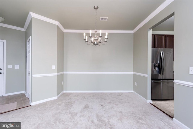 unfurnished dining area featuring ornamental molding, light colored carpet, and a chandelier