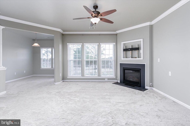 unfurnished living room with ornamental molding, light colored carpet, and ceiling fan