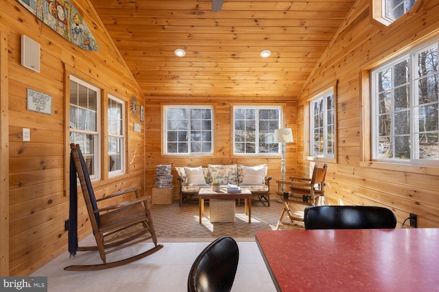 sunroom with a wealth of natural light, lofted ceiling, and wooden ceiling