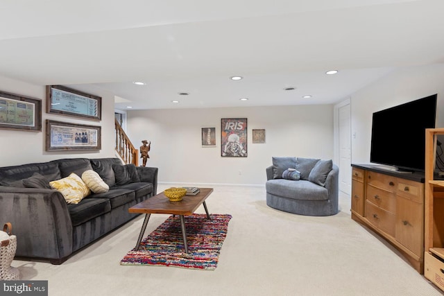 living area featuring light carpet, baseboards, stairway, and recessed lighting