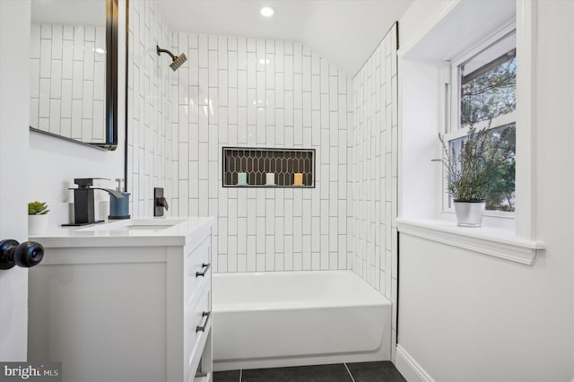 full bathroom featuring baseboards, bathing tub / shower combination, vanity, and tile patterned flooring