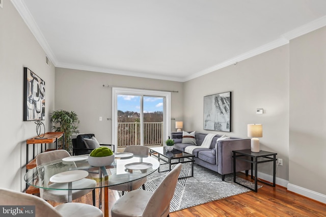 living room with crown molding and wood-type flooring