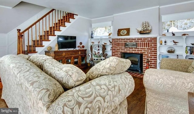 living room featuring crown molding, dark hardwood / wood-style floors, and a fireplace