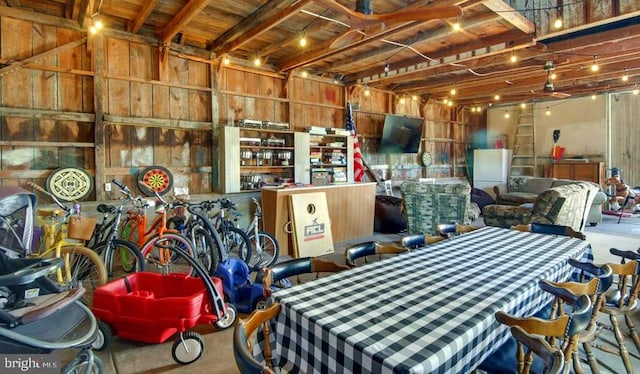 garage featuring wooden walls