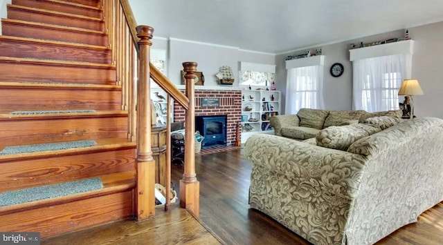 living room with a fireplace and dark hardwood / wood-style floors