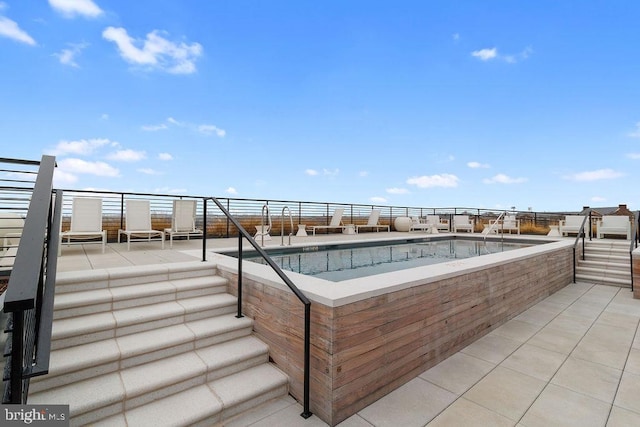 view of pool with a patio area