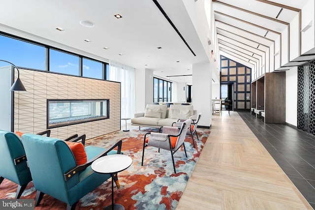 living room featuring a tile fireplace