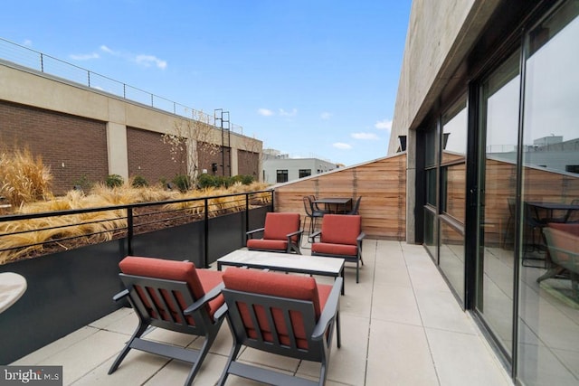 view of patio / terrace with a balcony