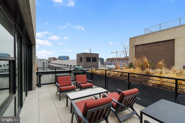 view of patio featuring a balcony