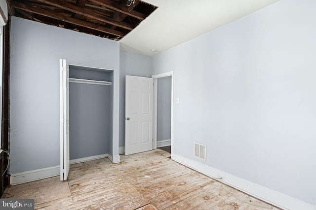 unfurnished bedroom with a closet