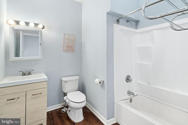 full bathroom featuring vanity, hardwood / wood-style floors,  shower combination, and toilet