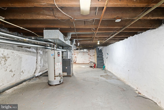 basement with water heater and heating unit