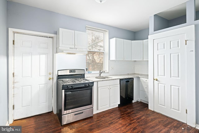 kitchen with stainless steel range with gas cooktop, dark hardwood / wood-style floors, white cabinetry, black dishwasher, and sink