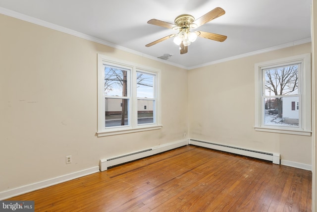 unfurnished room featuring crown molding, a baseboard radiator, wood-type flooring, and ceiling fan