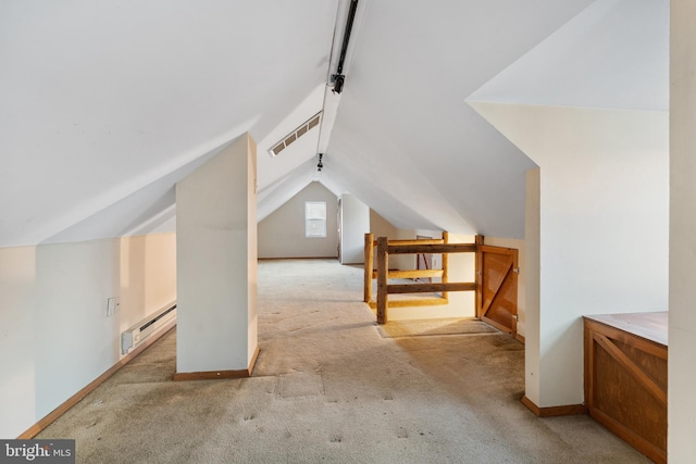 bonus room with vaulted ceiling, light colored carpet, and baseboard heating