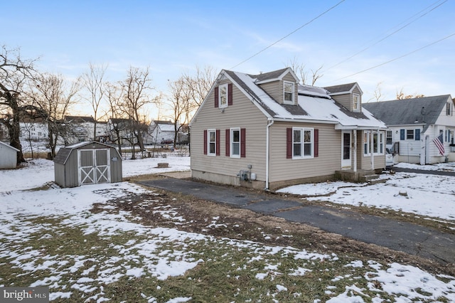 view of front of home with a storage shed