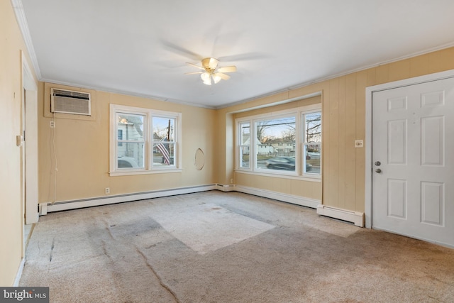 interior space with light carpet, a baseboard heating unit, a wealth of natural light, and a wall mounted AC