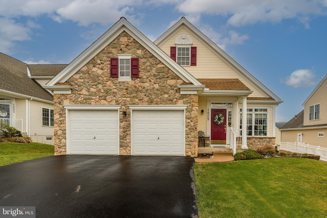 view of front facade featuring a garage and a front yard