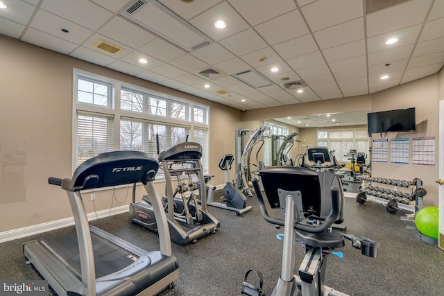 workout area featuring a paneled ceiling