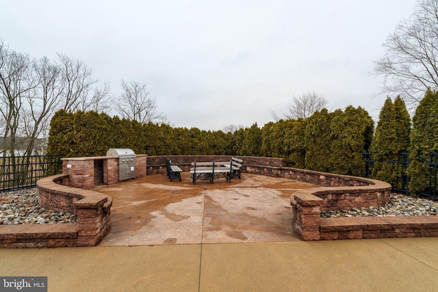 view of patio featuring a grill and an outdoor kitchen