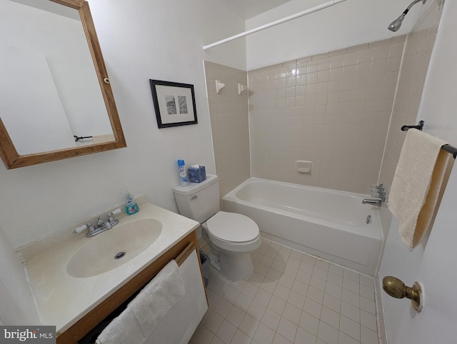 full bathroom featuring vanity, tiled shower / bath, tile patterned floors, and toilet