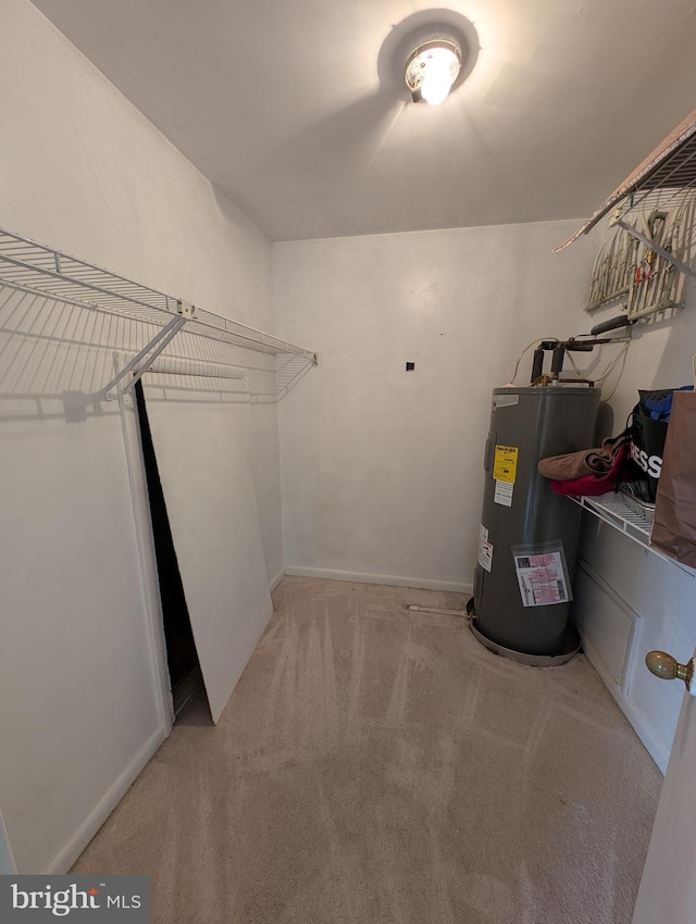 utility room featuring electric water heater