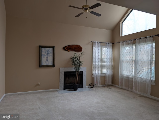 unfurnished living room featuring ceiling fan, a fireplace, high vaulted ceiling, and light carpet