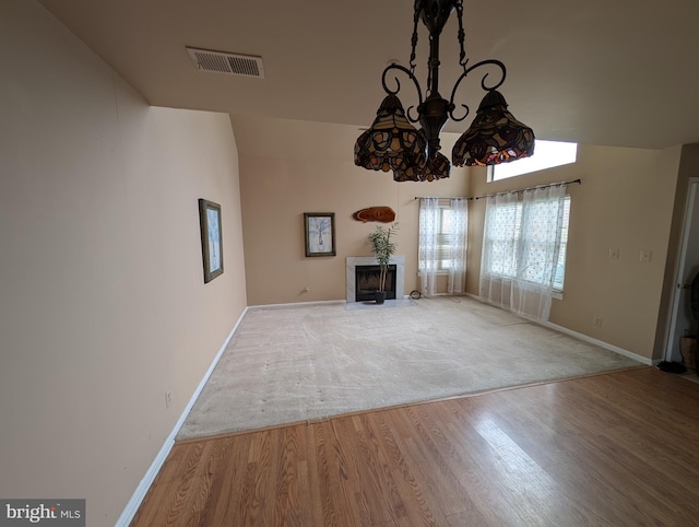 unfurnished living room with hardwood / wood-style flooring