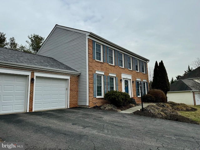 colonial house featuring a garage