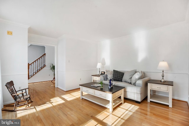 living room featuring hardwood / wood-style floors and ornamental molding