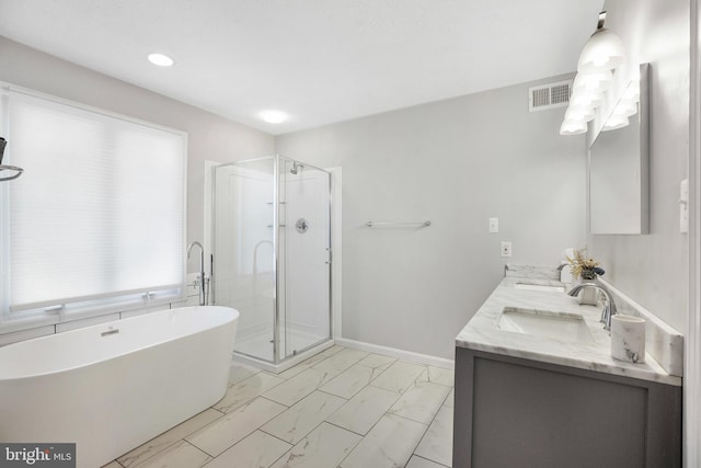 bathroom with independent shower and bath and vanity