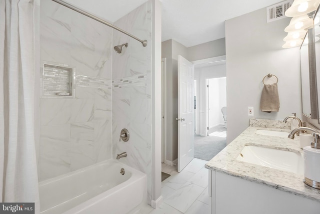 bathroom featuring vanity and shower / tub combo with curtain