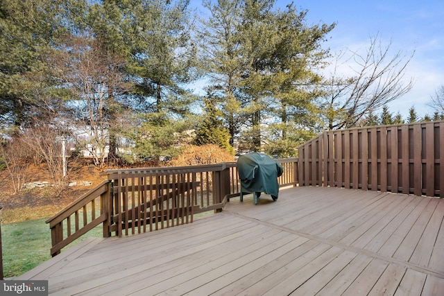 deck featuring a grill