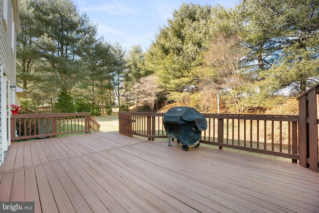 wooden terrace featuring grilling area