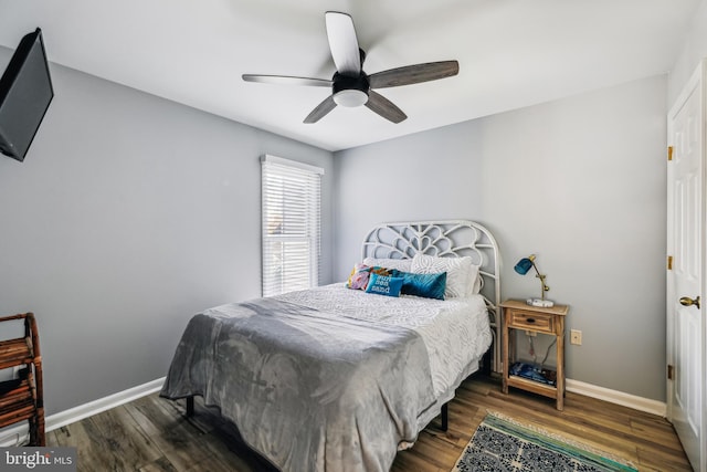 bedroom featuring dark hardwood / wood-style flooring and ceiling fan