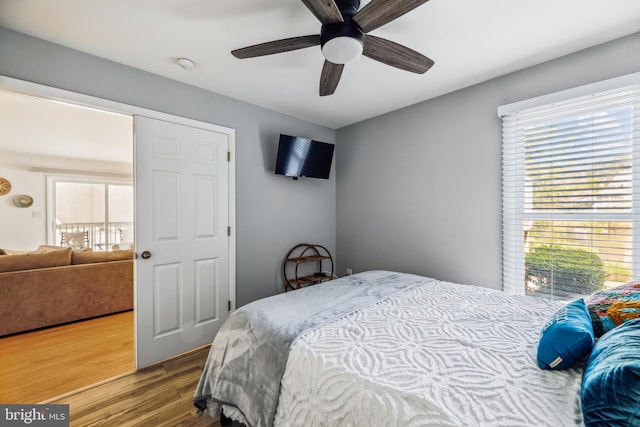 bedroom with hardwood / wood-style floors and ceiling fan