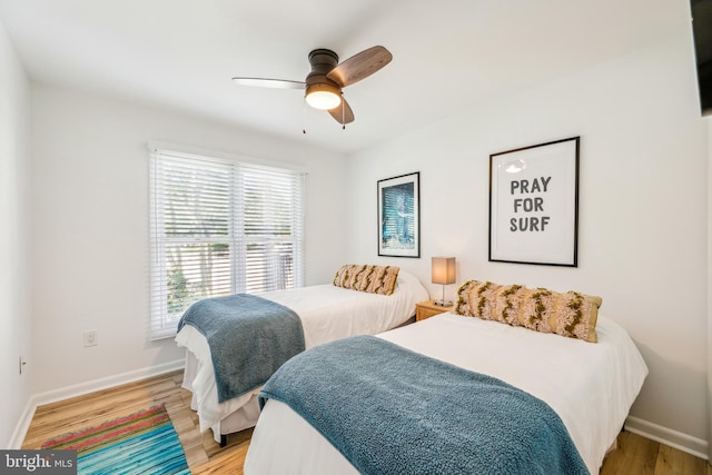 bedroom with ceiling fan and light wood-type flooring