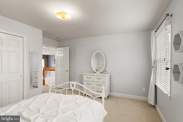 bedroom featuring light colored carpet