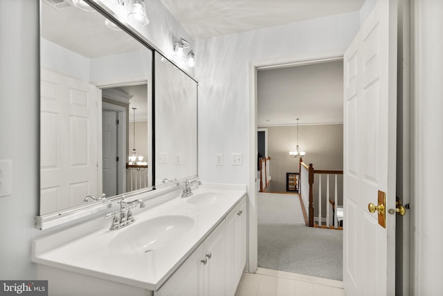 bathroom featuring vanity and a chandelier