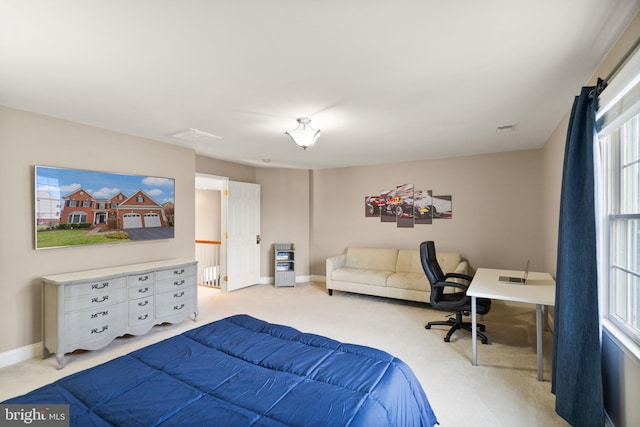 bedroom featuring light carpet