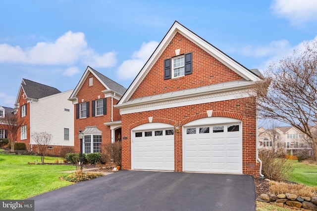 front facade featuring a garage and a front yard