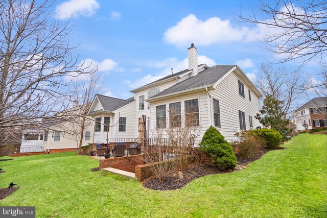 back of house featuring a yard