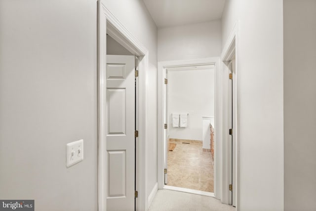 hallway with light carpet